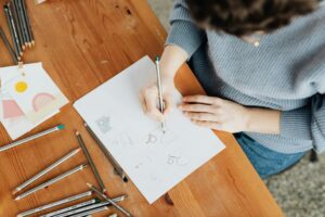 Woman drawing on a sheet of paper 
