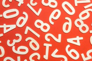 White numbers scattered around a red background